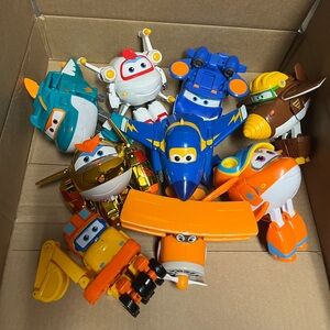 9 Superwings full size transforming action figures all in good used condition.